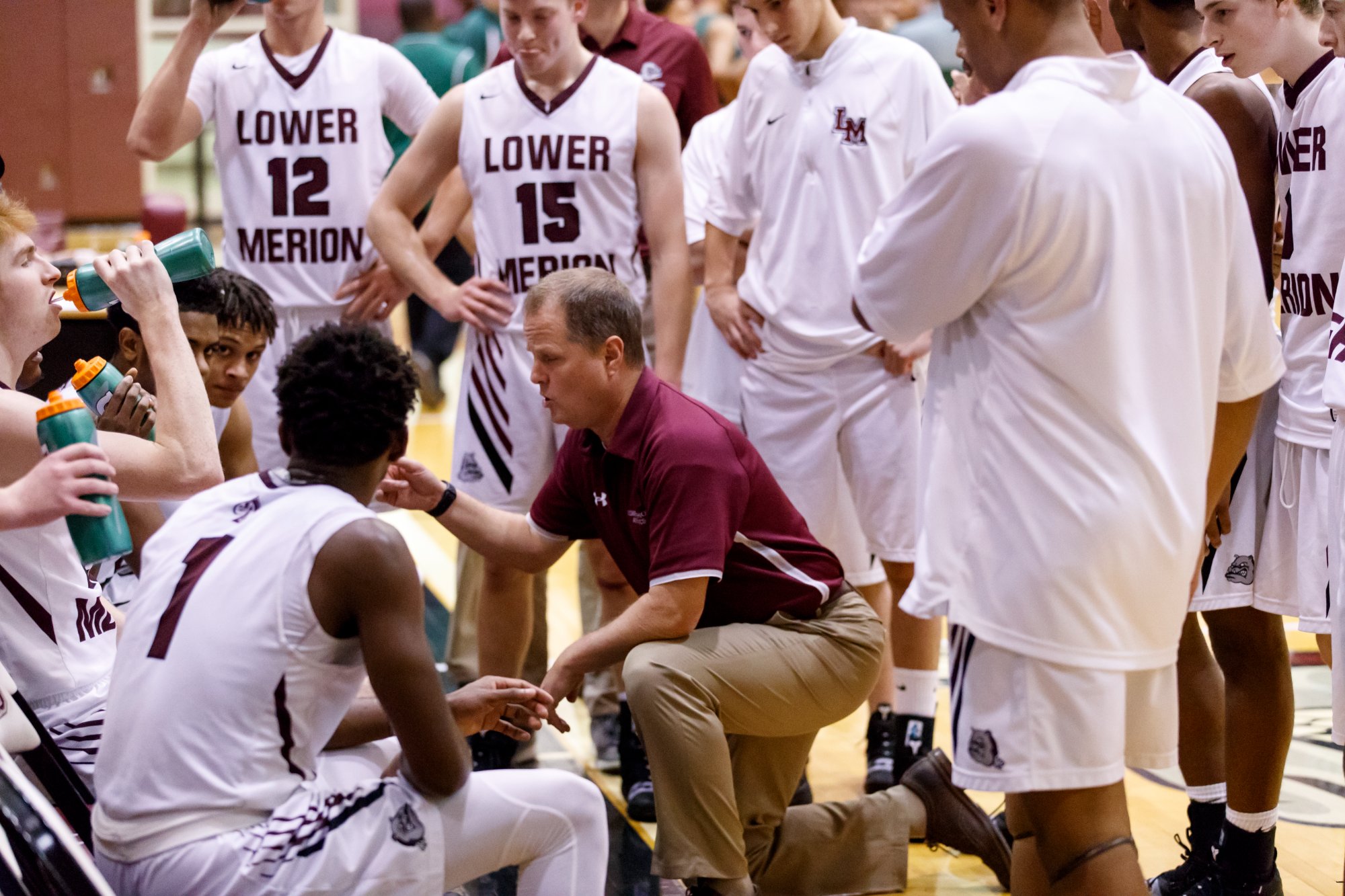 Team huddle with Coach Downer